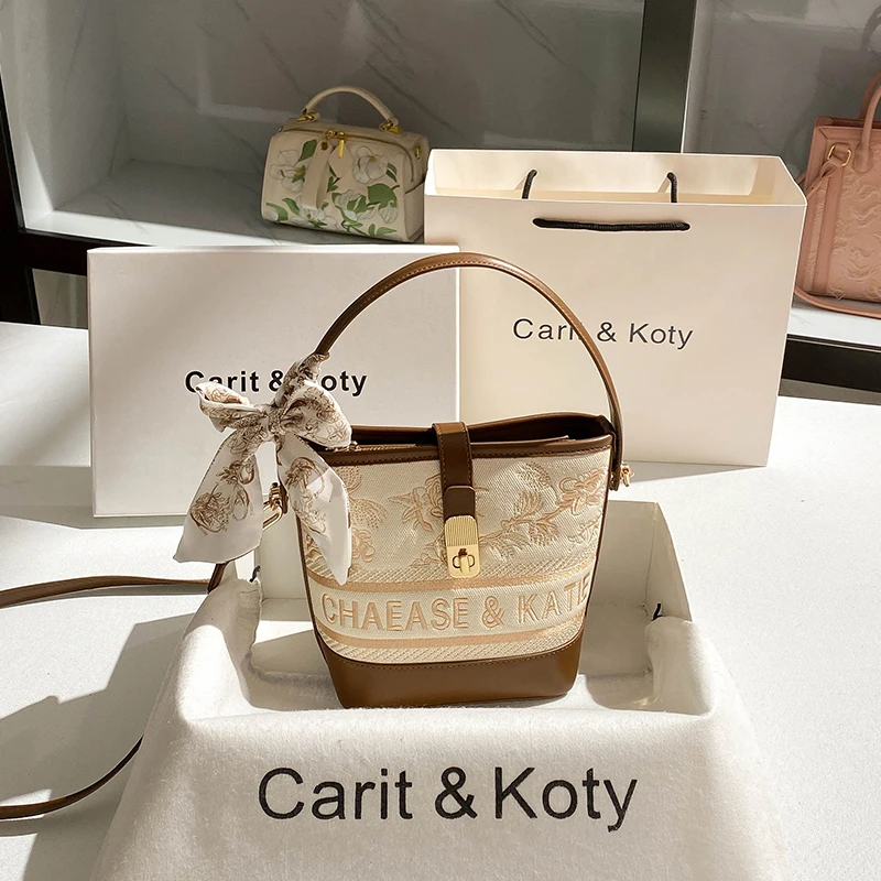 2025 Sac seau et sac à bandoulière avec broderie florale et motif de logo et sac à main pour femme en matériau de haute qualité pour un usage quotidien