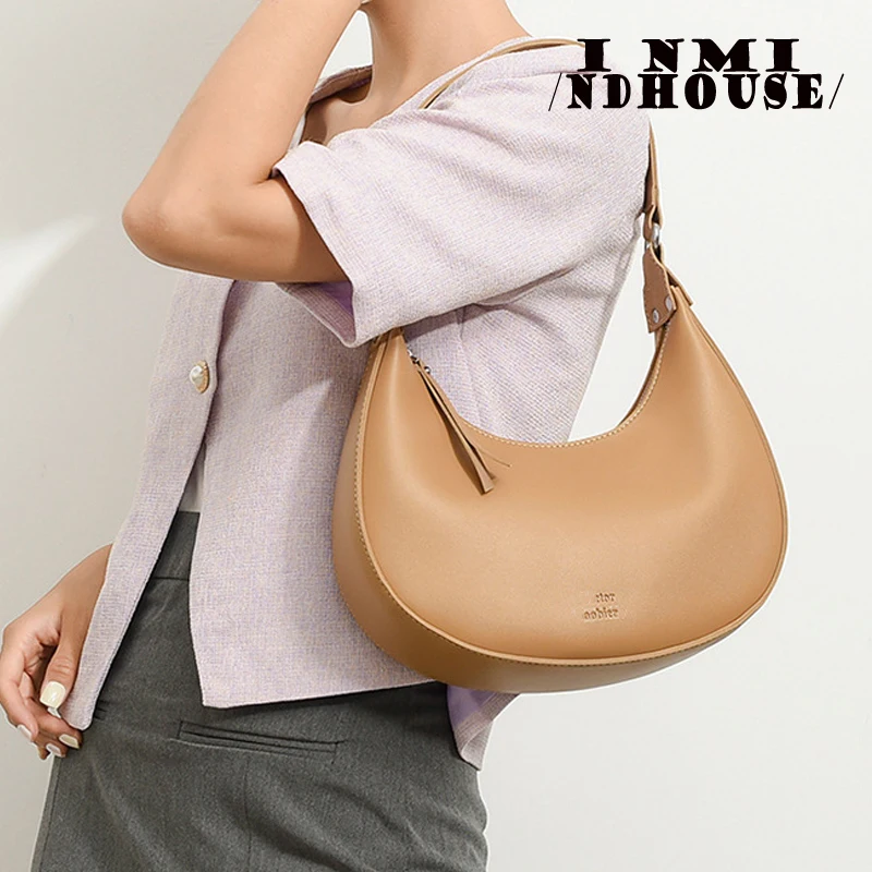 Sac baguette cartable de style européen et américain, sac sous les ati elles, sac de moto à bandoulière populaire, design littéraire, tendance, nouveau, été 2024