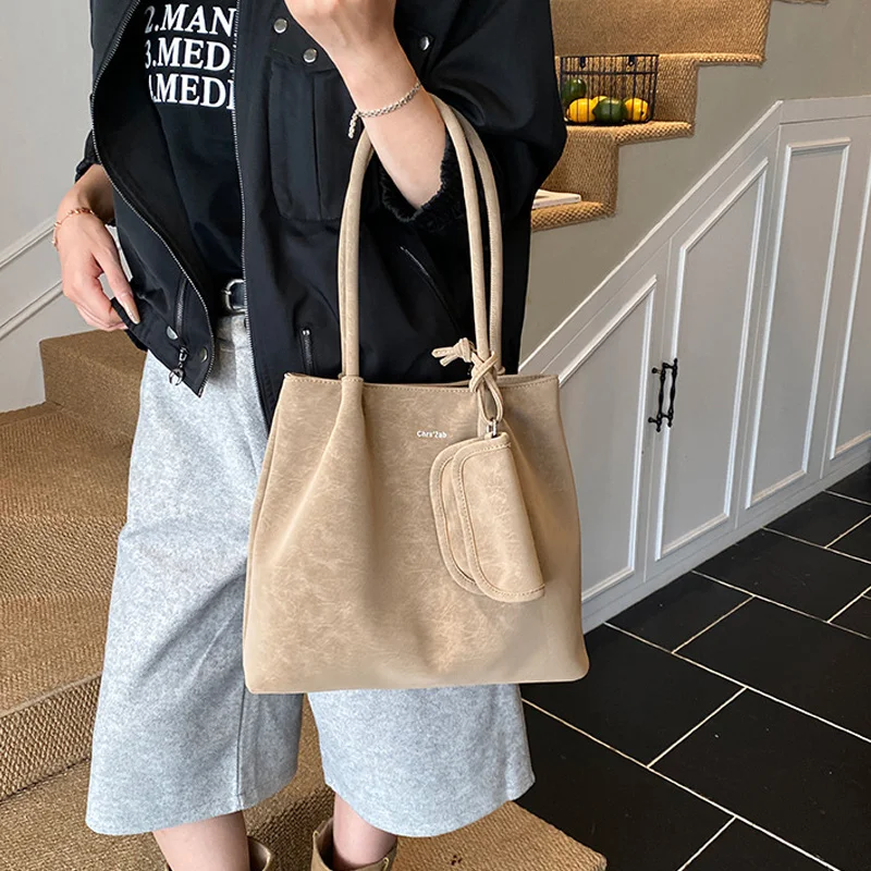 sac seau rétro mode europe amérique sac fourre tout tendance simple polyvalent design unique sac à bandoulière nouveau sac pour femmes de grande capacité