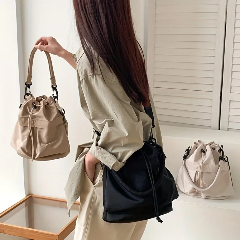 sac seau à cordon de serrage pour femmes, nouvelle mode, sac seau de grande capacité, style vêtements de travail simples, sac à bandoulière en nylon pour femmes