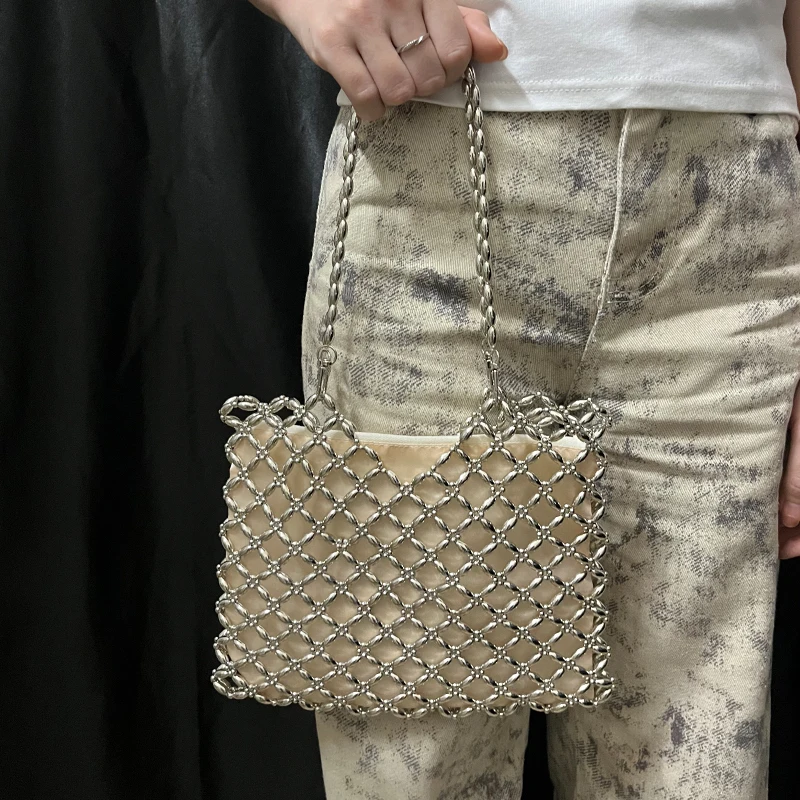 sac femmes 2025 nouveau décontracté à la main argent perlé creux sac tissé sac à main simple épaule sous les bras mère sac