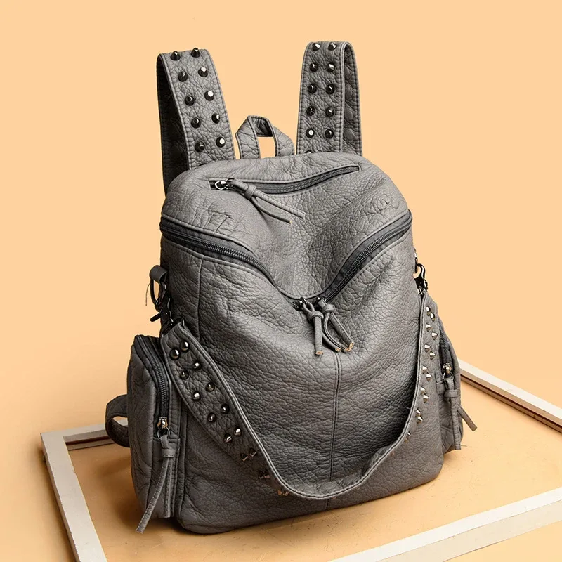 sac dos cuir souple polyester bleu noir gris marron poche ouverte fermeture éclair bandoulière arquée usage voyage femme décontracté