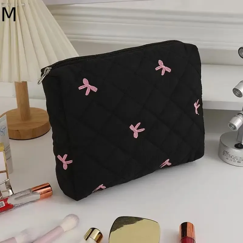 organisateur voyage polyester noir motif géométrique nœuds roses grande capacité matelassé usage journalier cosmétiques maquillage transport facile