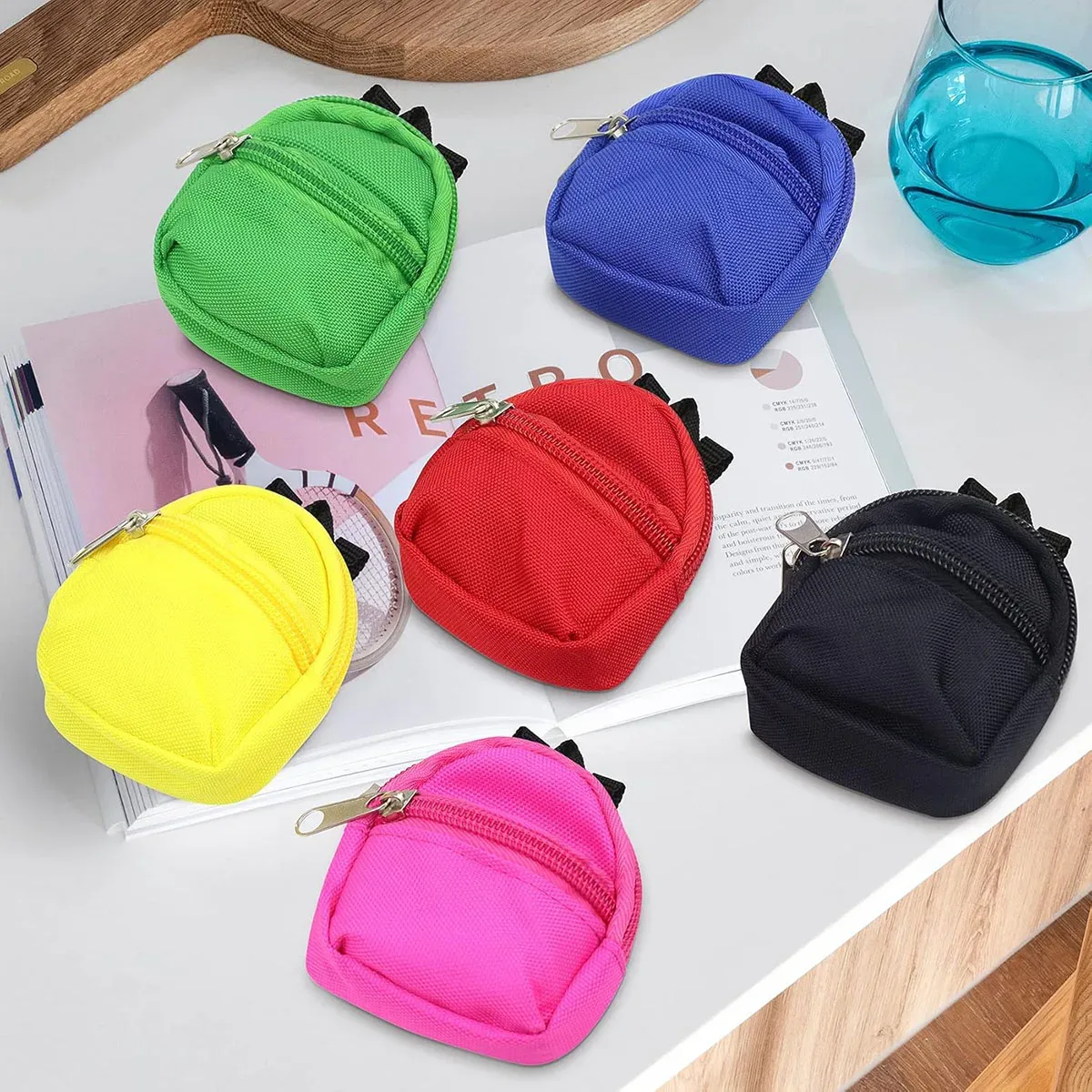 sac dos nylon petit format ovale fermeture glissière poche latérale double épaule poches latérales couleur vivante usage voyage
