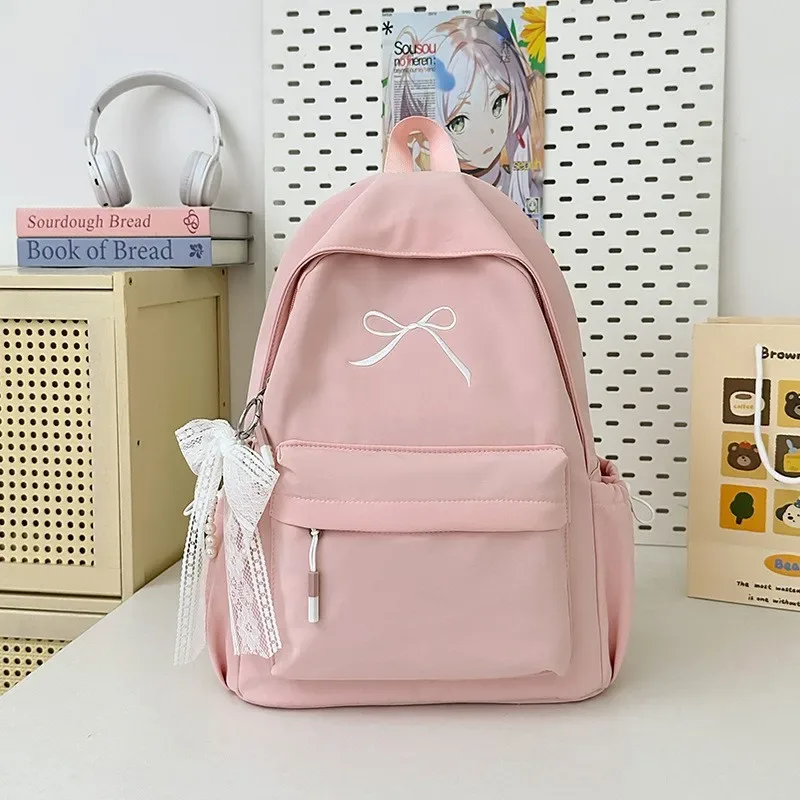 sac à dos portable brodé avec nœud pour filles, sac d'école en nylon de couleur unie pour étudiants, sac à dos de voyage léger de grande capacité pour femmes