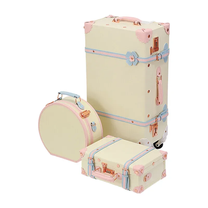 valise design rétro beige accents roses bleus motifs floraux poignée supérieure roulettes plastique dur voyage