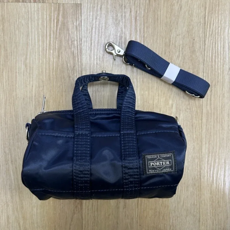 sac à main porter howl mini 2way pour hommes et femmes, petit sac bandoulière léger, style streetwear, mode quotidienne, portable pour les trajets quotidiens et les voyages.