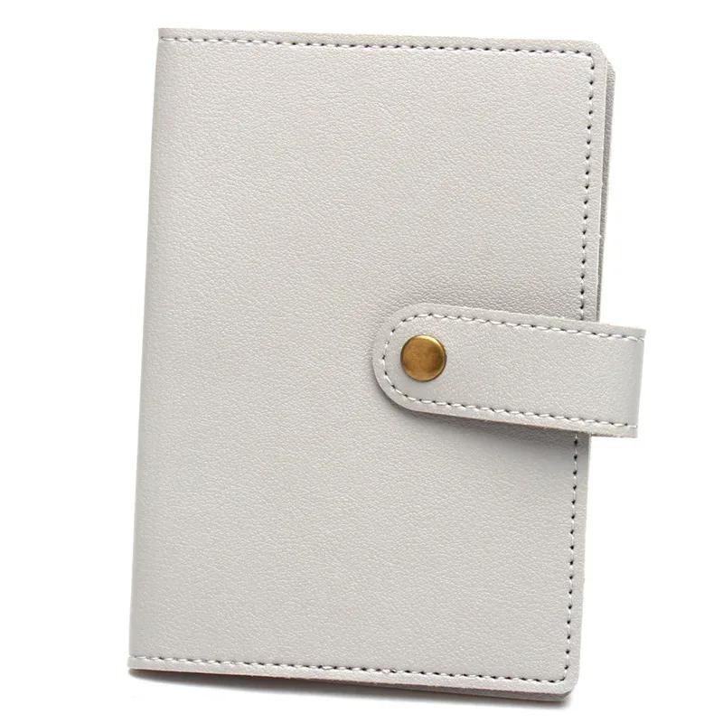 étiquette bagage porte cartes identité voyage accessoires compacts couleurs variées pochettes intérieures fermeture bouton doré usage international