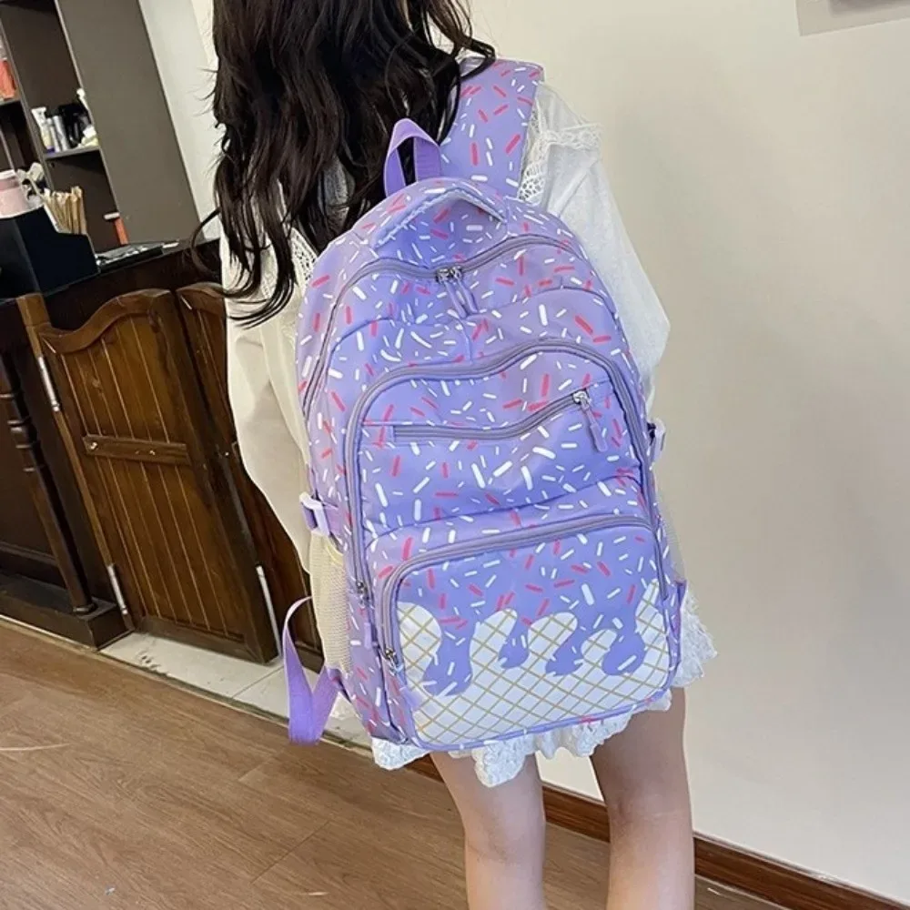 sac dos toile oxford motifs crème glace couleurs roses blanches format petit taille grande capacité bandoulière trousse crayons usage étudiant sortie