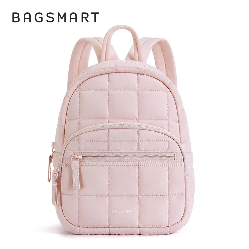 sac dos polyester rose pâle motif géométrique relief matelassé poches pratiques anti-vol organisation objet essentiels voyage