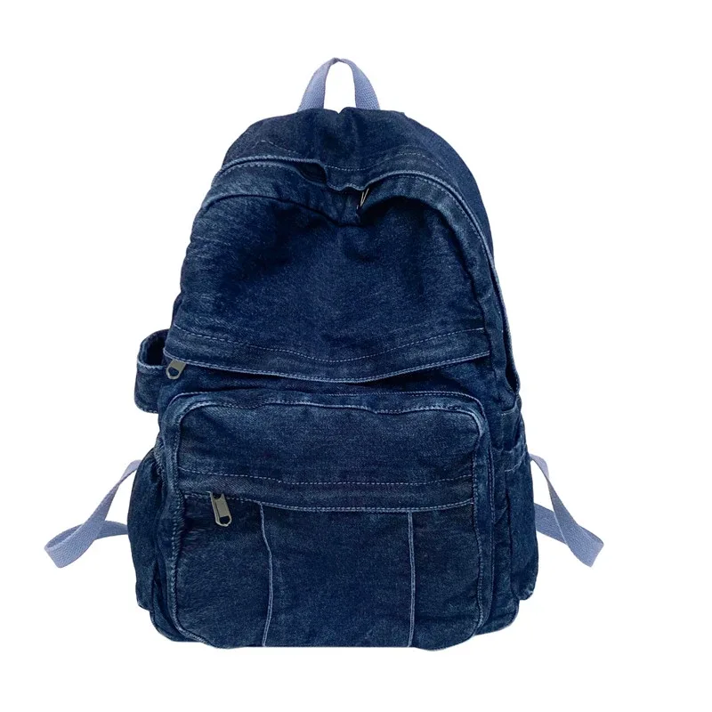 sac dos jean bleu denim cuir marron poche avant zippée bandoulières souplement détendu usage voyage école quotidien transport ordinateur portable