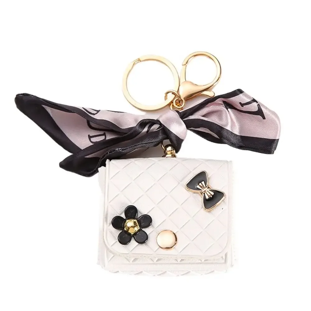 nouvelle pochette de rangement en cuir 2026 pour écouteurs, mini porte-clés créatif, pendentif couleur unie, étui pour écouteurs bluetooth