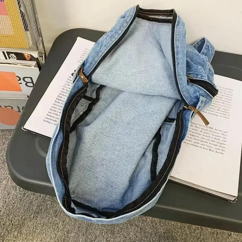 sac dos jean bleu denim poignée supérieure fermeture éclair compartiment intérieur usage étudiant voyage