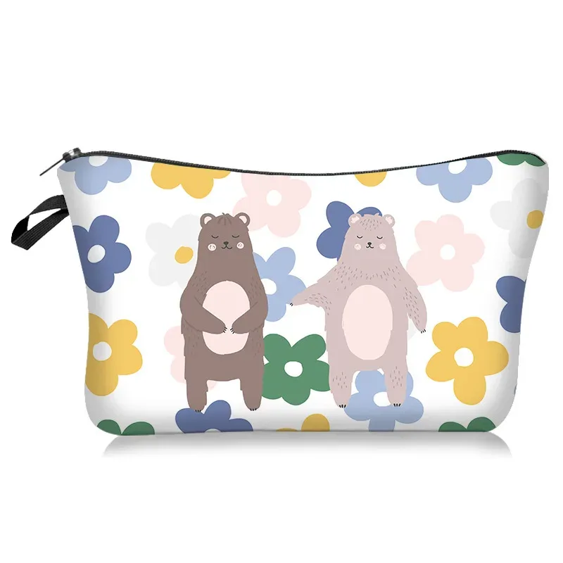le nouveau sac de maquillage de la série à motifs légers et frais se vend bien. c'est un sac de rangement à main avec une housse en tissu polyester.