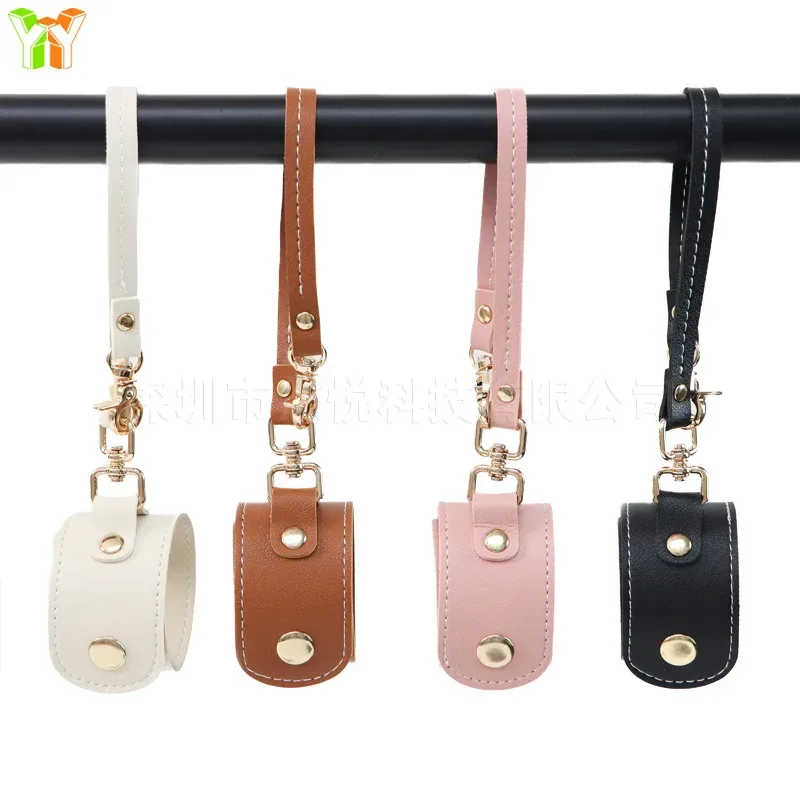 bracelet accessoire cuir voyage blanc marron rose pâle noir ovale pendentif sangle organisation légère