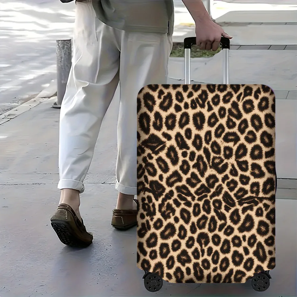 housse valise polyester motif léopard beige noir protection voyage accessoires voyage forme rectangulaire poignées latérales roulettes extérieures
