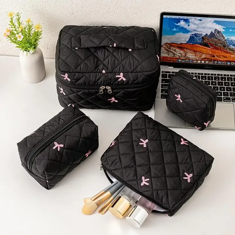organisateur voyage polyester noir motif géométrique nœuds roses grande capacité matelassé usage journalier cosmétiques maquillage transport facile