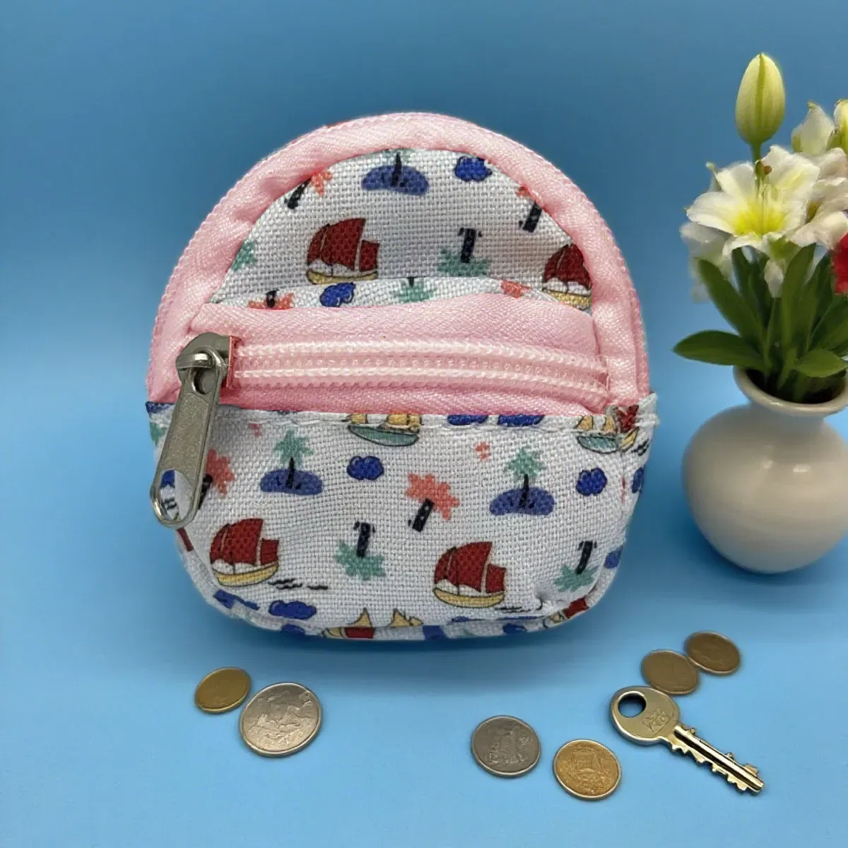 sac dos nylon petit format ovale fermeture glissière poche latérale double épaule poches latérales couleur vivante usage voyage