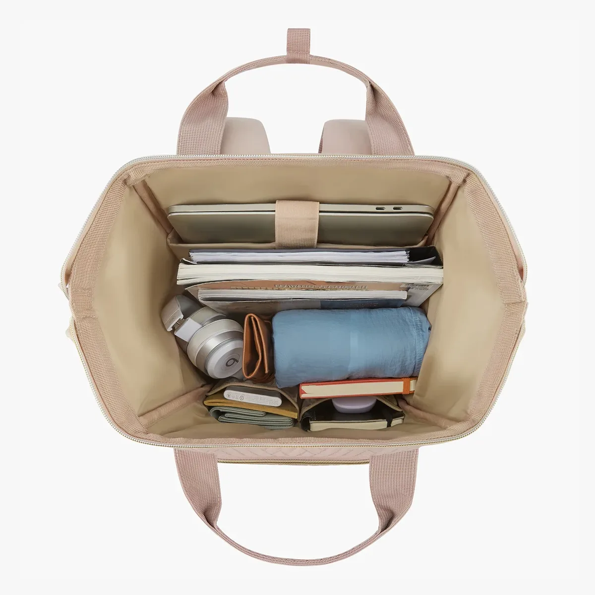 sac dos nylon rose pâle motif géométrique relief poches latérales grande ouverture fermeture glissière bandoulière arquée usage voyage universitaire