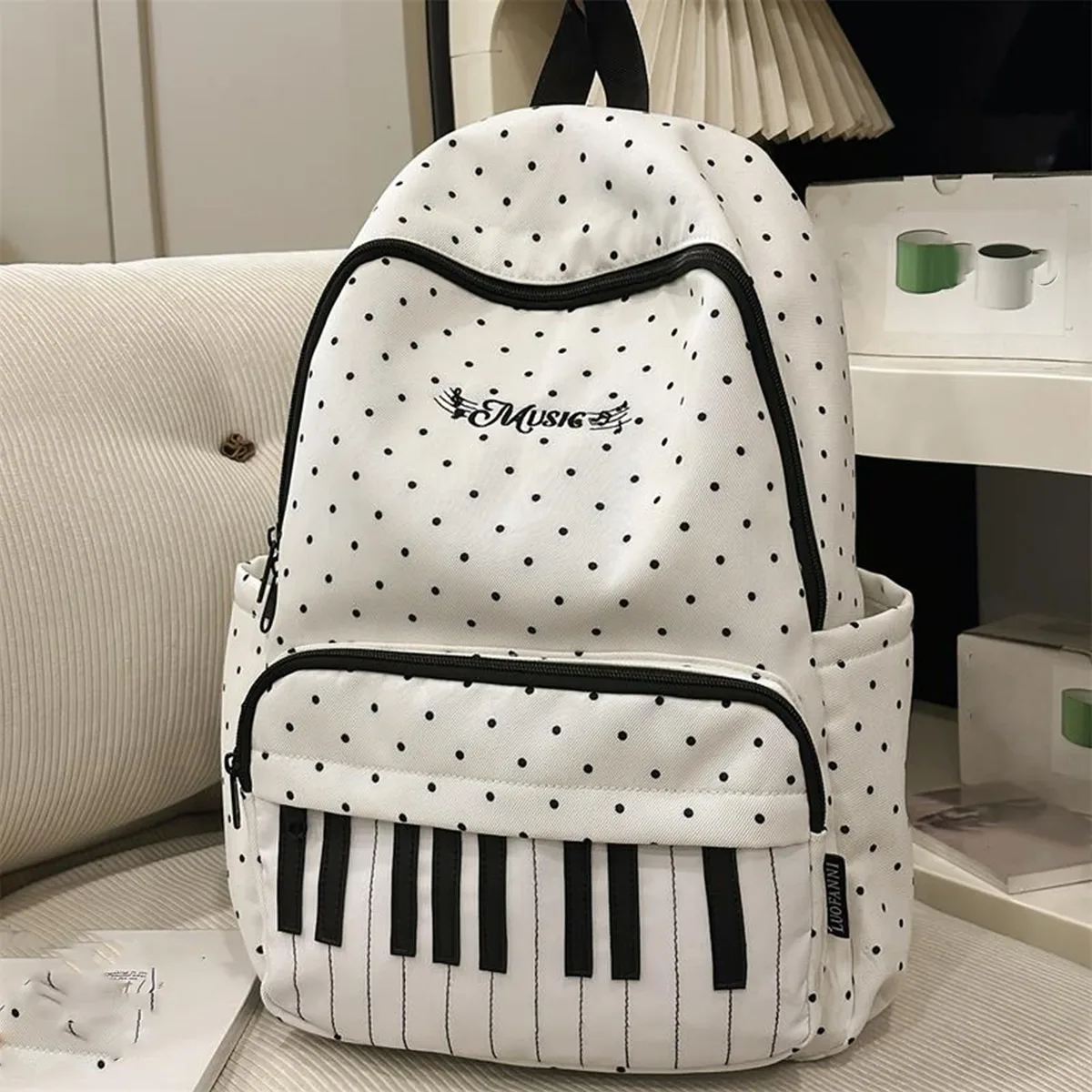 sac à dos décontracté en nylon de 16,9 pouces à pois avec motif clavier de piano et pendentif pour filles, idéal pour les voyages, le shopping et l'usage quotidien