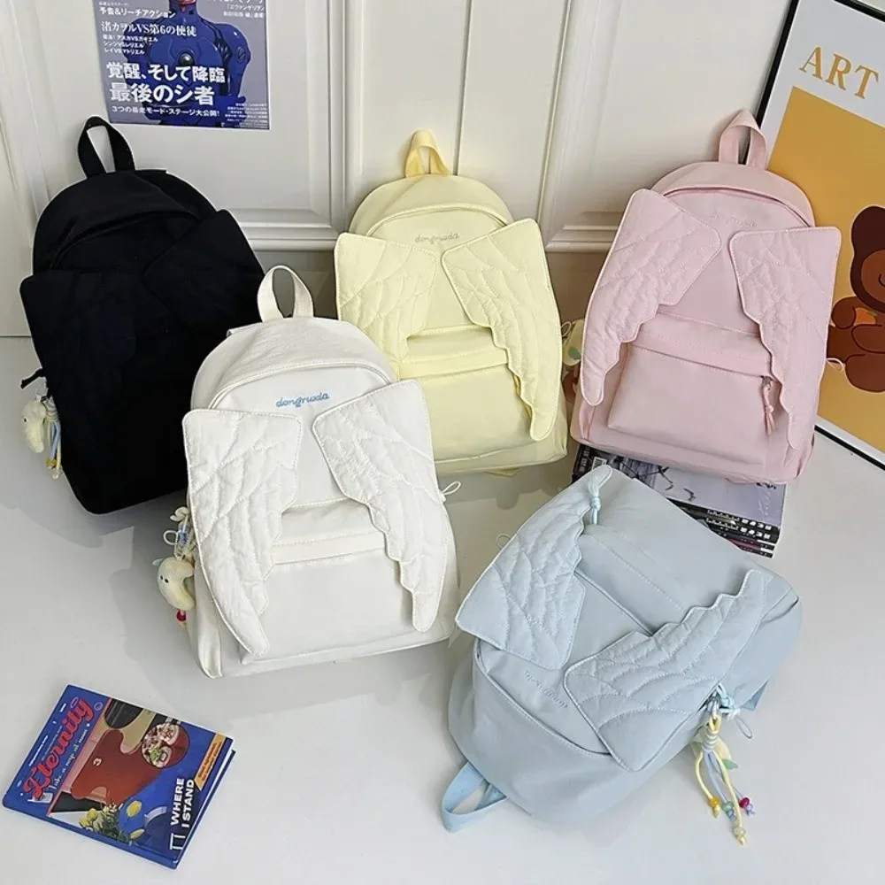 sac à dos polyvalent à ailes d'ange, couleur unie, grande capacité, sac à dos en toile, style y2k, motif brodé, sac à dos en nylon