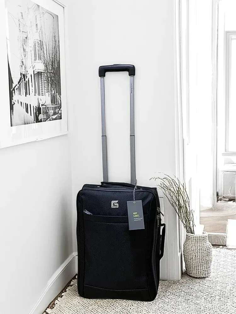 sac voyage polyester noir motif géométrique relief roulettes fixes poignée supérieure hauteur cinquante centimètres