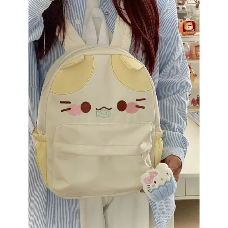 sac à dos imperméable en nylon pour femme avec motif chat dessinant une fille mangeant du poisson, sac d'école pour filles avec détails brodés, sac à livres