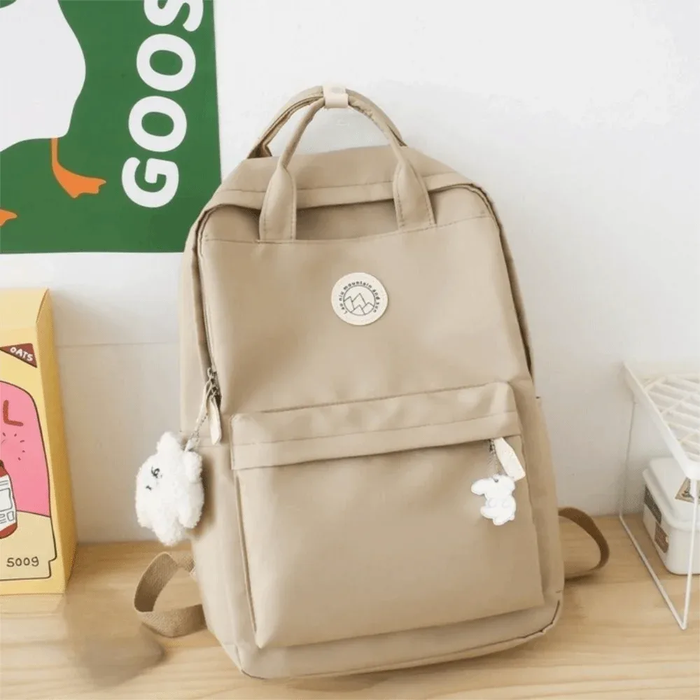 sac à dos léger et imperméable pour femmes, grande capacité, couleur unie, sac d'école en nylon, sac à dos ergonomique de voyage et de loisirs