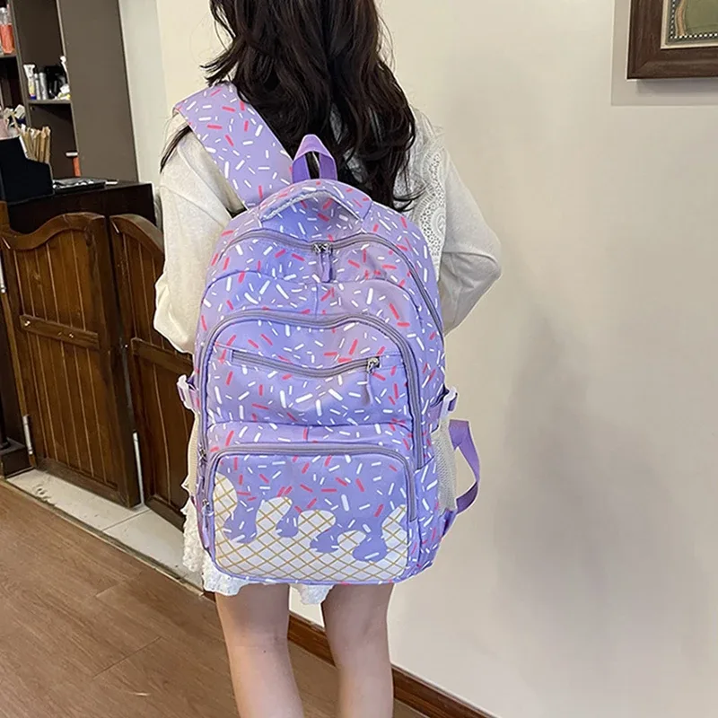 sac dos polyester motifs glace fond rose bleu violet conception uniforme poches lateral fermeture glissière imperméable poche integree femme voyage