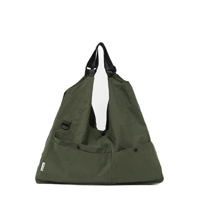 sac dos nylon jaune vert rose poches ouvertes bandoulière arquée fermeture éclair capacité inferieure deuxize litres usage voyage décontracté jacquard