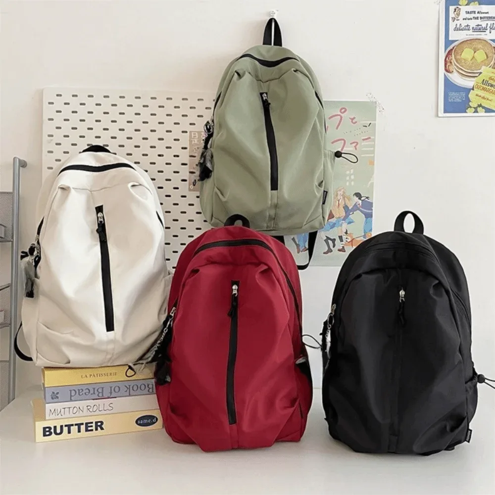 nouveau sac à dos simple de grande capacité, léger et étanche, sac à dos de randonnée avec fermeture éclair, couleur unie, sac d'université pour l'extérieur