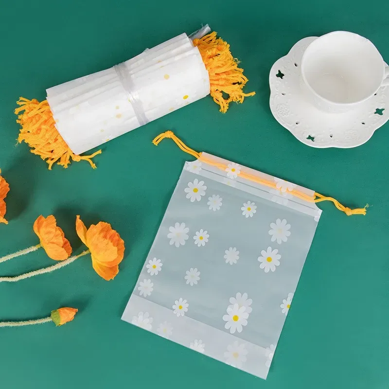 organisateur voyage transparence motif fleurs blanches fond gris corde jaune nylon plastique petit moyen grand