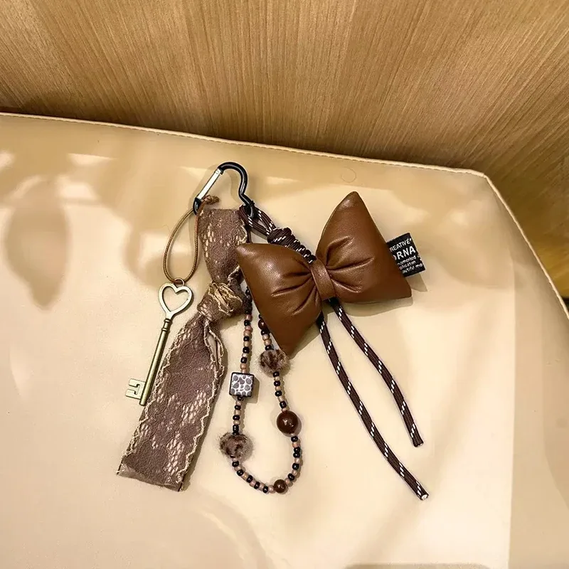 porte-clés à nœud en cuir matelassé doux, organisateur, mini breloque de sac mignon pour filles, porte-clés à nœud coréen avec pendentif