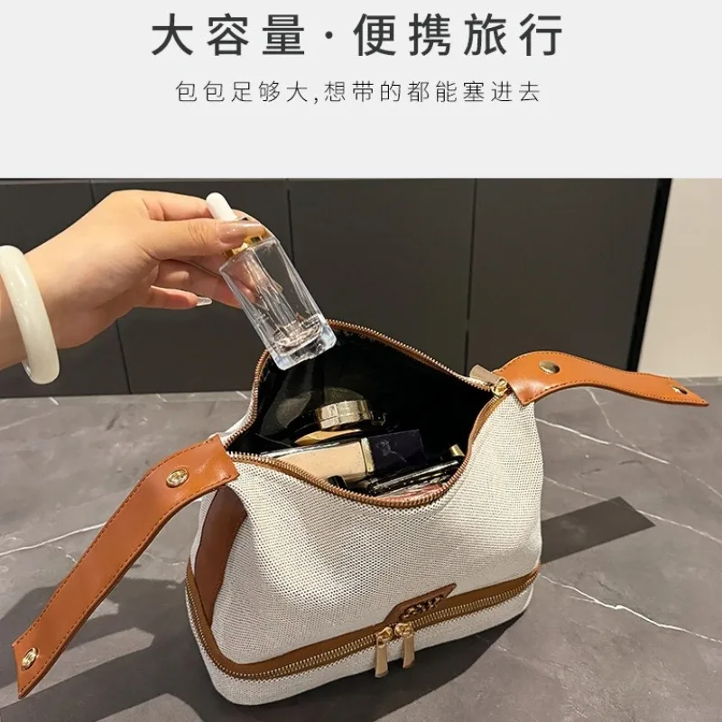 nouvelle trousse de maquillage portable en toile rétro de luxe avec étiquette métallique, de haute qualité et multifonctionnelle, idéale pour les voyages.