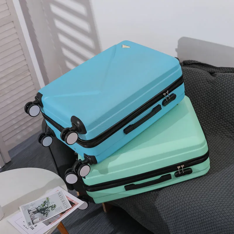 valise abs plastique dur motif géométrique lignes diagonales relief gris rose blanc jaune vert bleu rouge bagage affaires voyage