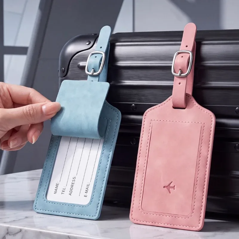 étiquette bagage cuir simili bleu noir rose voyage identification valise nom adresse pochette contact symbole avion reliefs