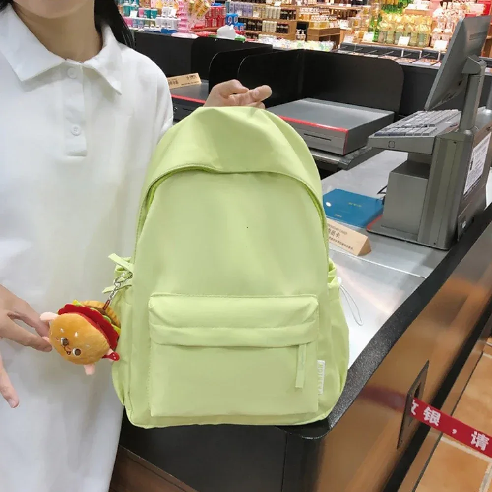 sac dos nylon polyester unisexe poche latérale zippée porte clés hamburger couleur solide voyage loisirs