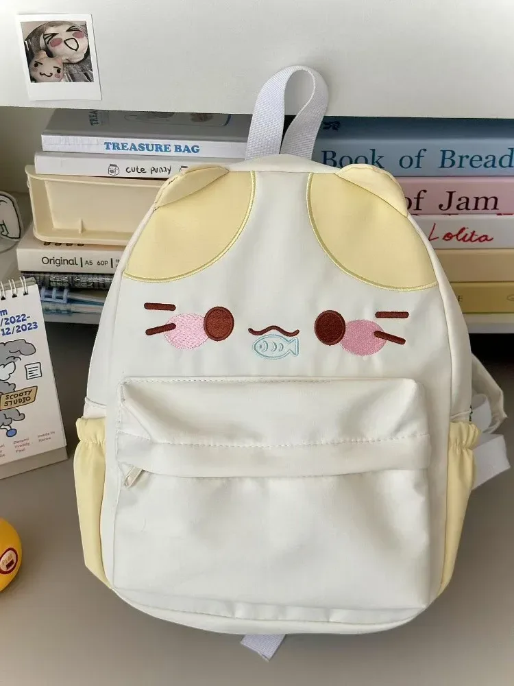 sac à dos imperméable en nylon pour femme avec motif chat dessinant une fille mangeant du poisson, sac d'école pour filles avec détails brodés, sac à livres