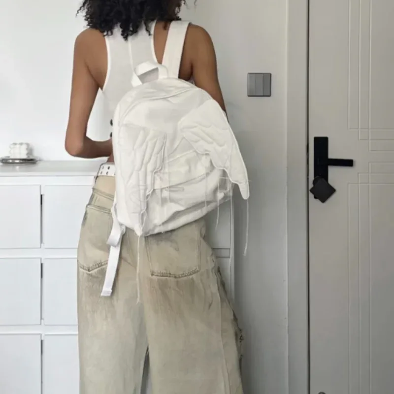 sac à dos à ailes style y2k pour femmes, sac en toile d'ange mignon japonais, pompon créatif, couleur unie, sac à bandoulière de grande capacité pour étudiantes