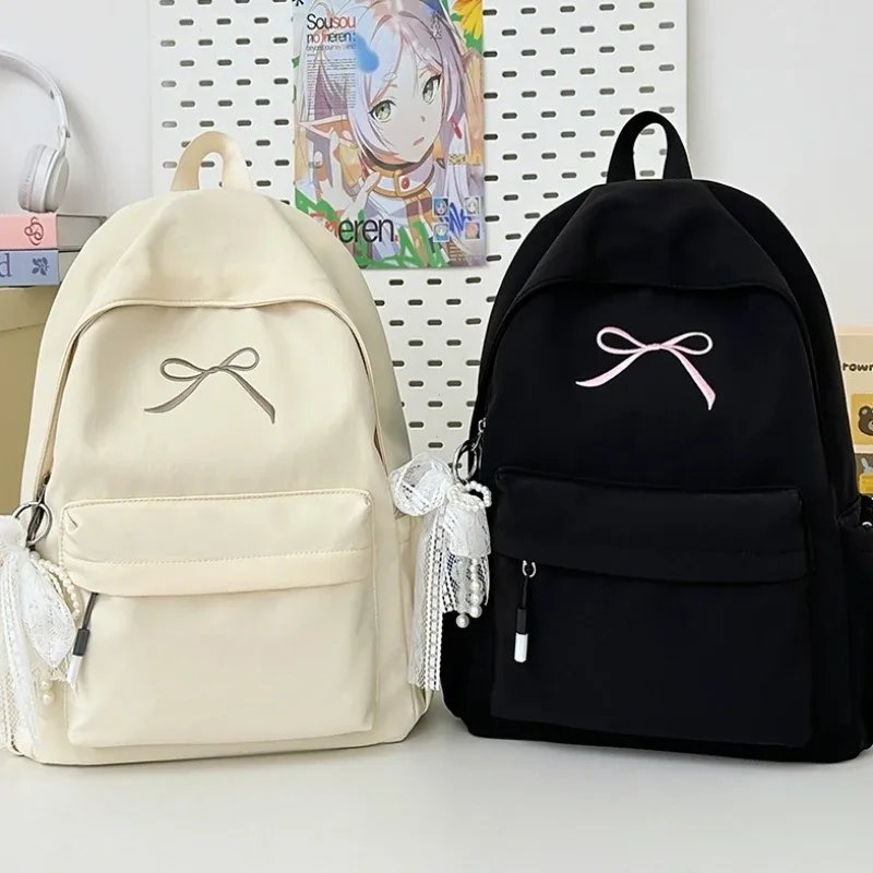 sac à dos portable brodé avec nœud pour filles, sac d'école en nylon de couleur unie pour étudiants, sac à dos de voyage léger de grande capacité pour femmes