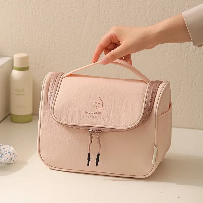 sac de toilette en taslon, imperméable pour voyage, sac de maquillage portable pour femmes, grand espace de rangement pour articles de toilette.