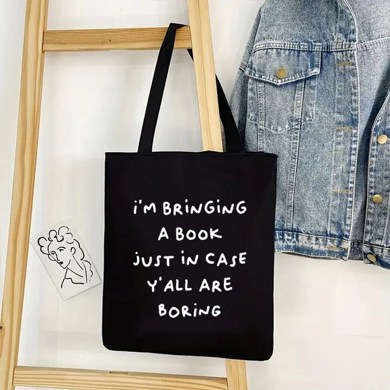 sac fourre-tout en toile imprimé double face 1a, fond noir avec texte blanc, matériau en polyester durable, très adapté pour les livres.