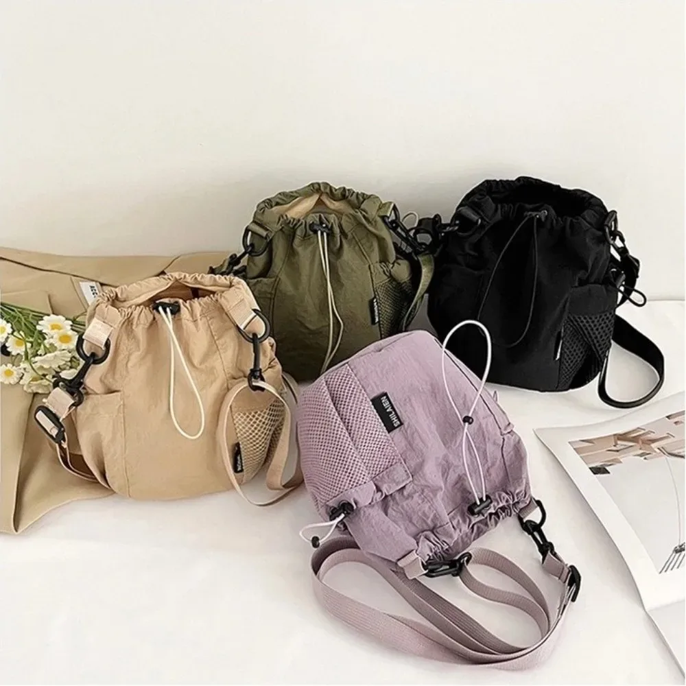 sac à bandoulière simple portable en nylon, petit sac léger de couleur unie pour l'extérieur