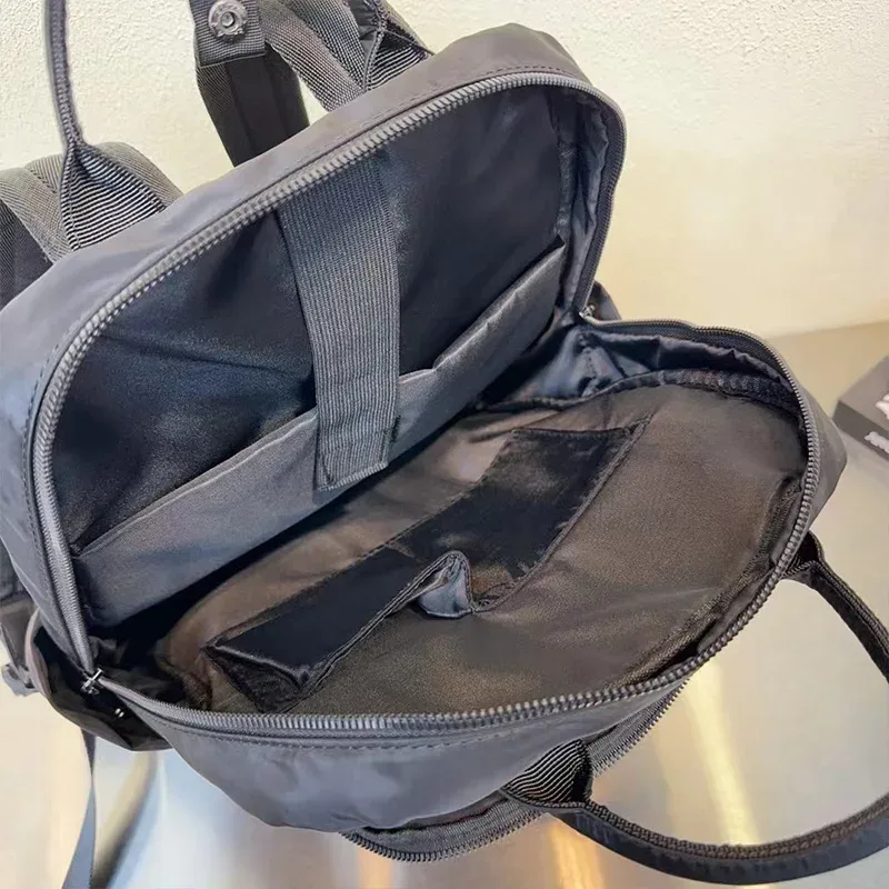 sac à dos en nylon de grande capacité, sac à dos de voyage multi-compartiments avec poignée pour les trajets quotidiens, l'école et les activités de plein air
