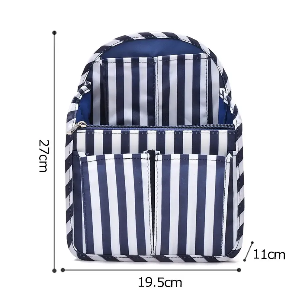 sac dos tissu oxford organisateur compartiments zips noir bandes blanches format rectangulaire poignée amovible usage voyage