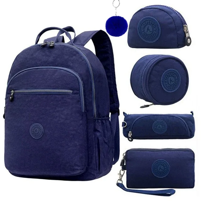 sac dos nylon gris anthracite compartiments poches latérales glissière accessoires pompon porte monnaie voyage école adolescente