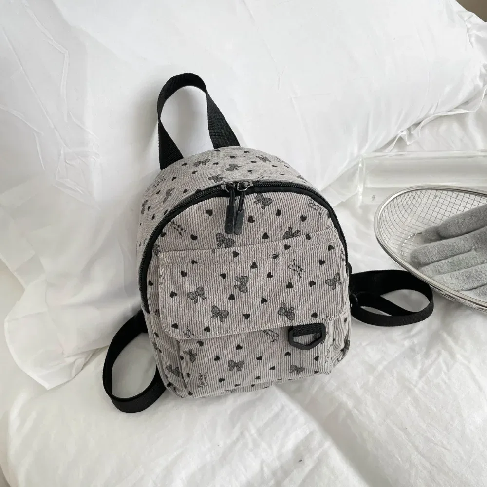 mini sac à dos en velours côtelé léger avec imprimé cœur et nœud, sac à bandoulière multi-compartiments à ouverture zippée, sac à dos quotidien