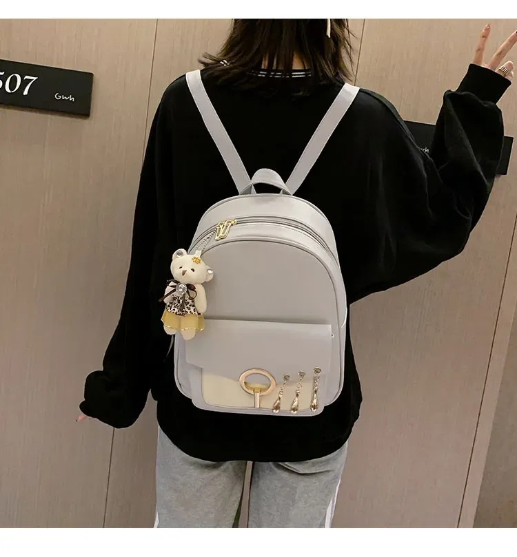 sac dos cuir synthétique gris motif géométrique relief bandoulière amovible porte-monnaie inclus voyage femme