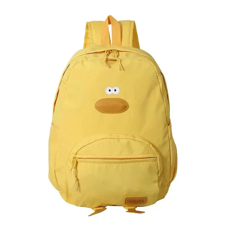 sac dos nylon noir jaune beige forme rectangulaire poignée souple bandoulière arquée fermeture glissière voyage femme étudiant école polyvalent