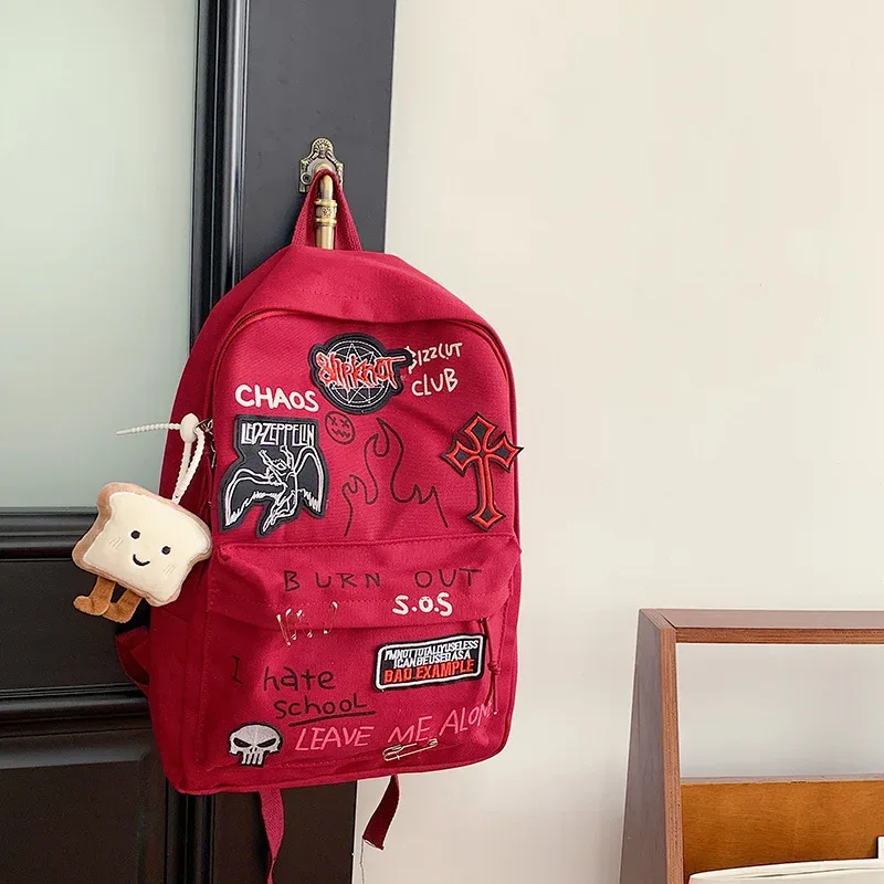 sac à dos gothique rock pour hommes et femmes, sac à dos décontracté en toile de grande capacité avec accents en métal et patchwork pour un usage quotidien
